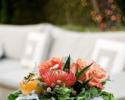 Rose roses, pin cushion protea designed in a concrete square contemporary vase.