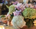 Lush hydrangea, double oriental lilies and ranunculus in shades of pinks and lime green.