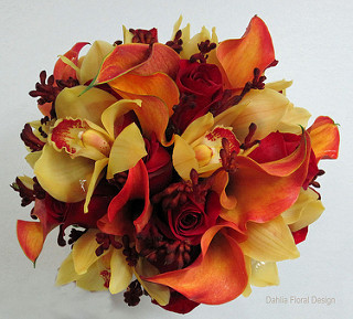 This unique bouquet was designed with orange miniature calla lilies, yellow cymbidium orchids, kangaroo paws and roses.