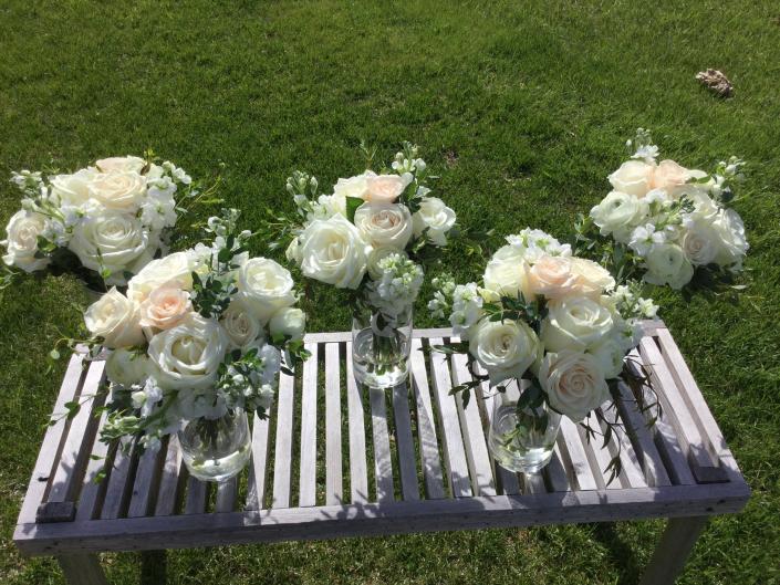 Ivory and champagne roses, stock and greenery.