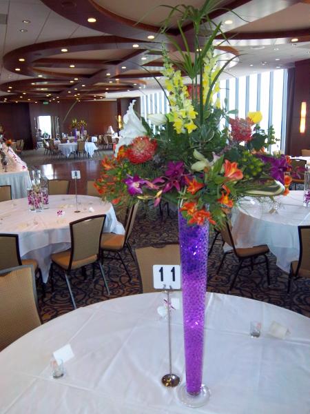 Bright vibrant colors with alstromeria, hot pink dendrobium orchids, snapdragons and white oriental lilies.
