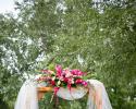 Pergola decorated at Courtyards of Andover, beautiful roses, gerbera daisies, gladiola and stock