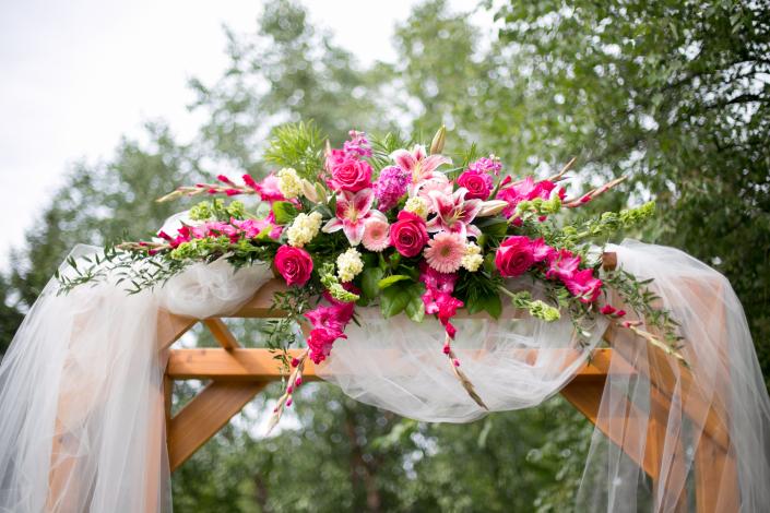 Hot pink gladiola, fragrant stock, roses