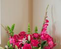 Stargazer lilies, roses, bells of Ireland, gerber daisies