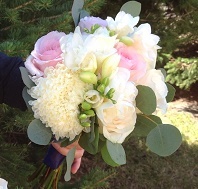 Roses, standard mums, freesia, seeded eucalyptus