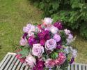 Garden look of purple roses, lavender and fushia stock. pink alstromeria and purple trachillium.