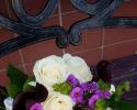 Dark purple minature calla lilies, ivory roses, bupleurum, fushia phlox.