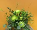 This bouquet designed in all green with spider mums, ferns, buplurem, hydrangea and silver dollar eucalyptus.
