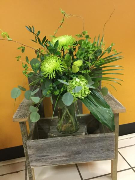 This bouquet designed in all green with spider mums, ferns, buplurem, hydrangea and silver dollar eucalyptus.