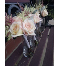 Soft romantic bouquet of champagne and ivory roses, accented with astilbe.