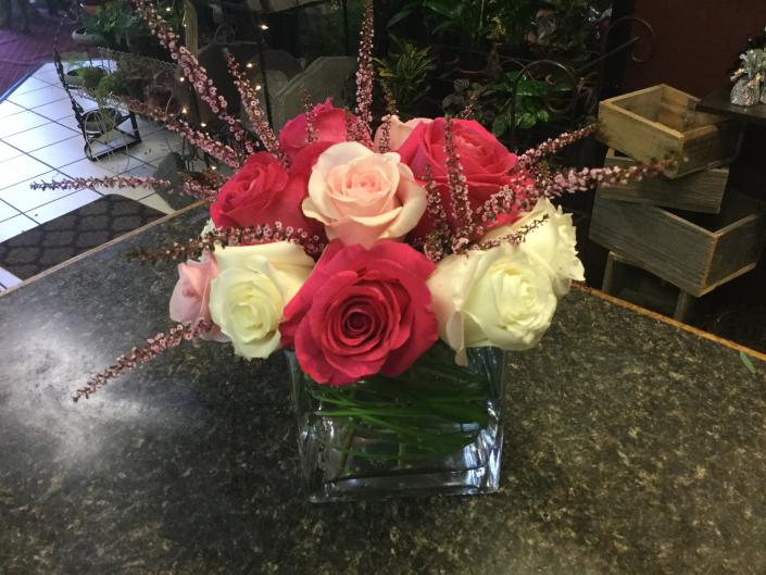 A variety of pink and white roses, Titanic, Pink Floyd, Mondial and accented with Calcyna.