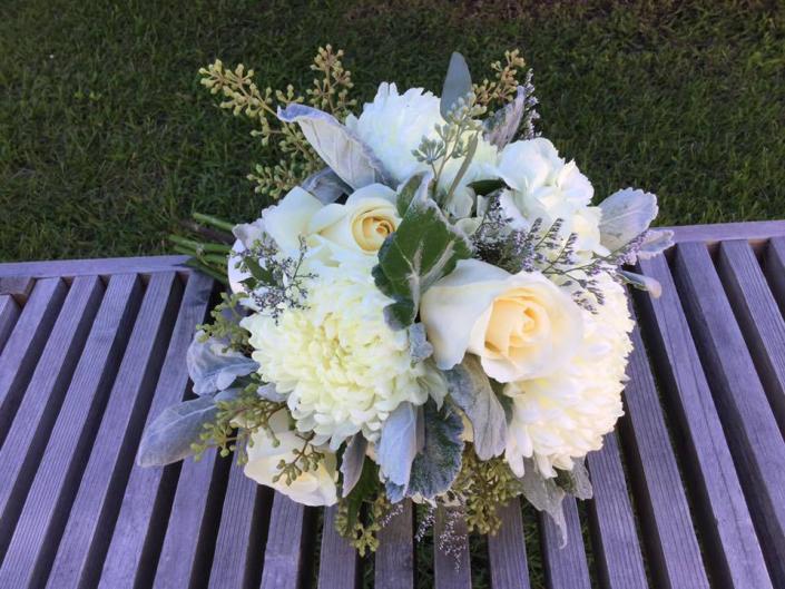 Ivory roses, standard mums, seed eucalyptus, dusty miller.