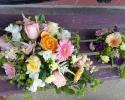 A cascading bouquet with gerber daisies, roses, freesia, astilbe, stock, phlox.....and a matching minature bouquet for the flower girl!